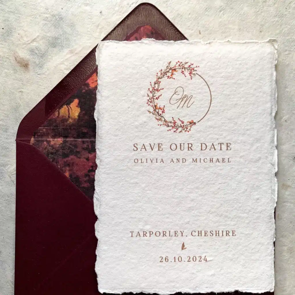 Save the date card with floral monogram and envelope