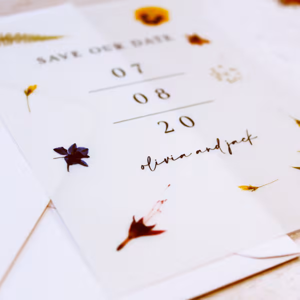 Save the date wedding card with dried floral details and elegant typography