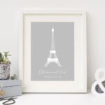 Framed Eiffel Tower print with personalised engagement names on neutral background