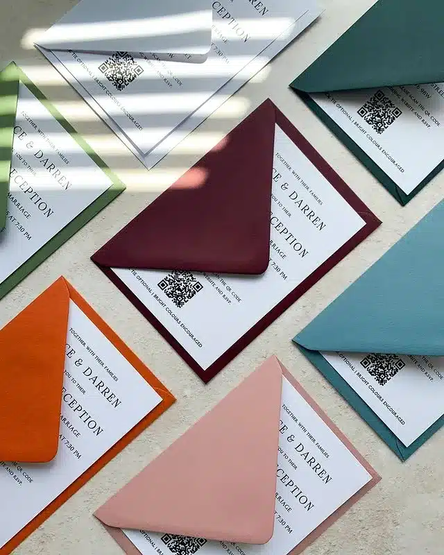 Colourful wedding invitation envelopes with cards.